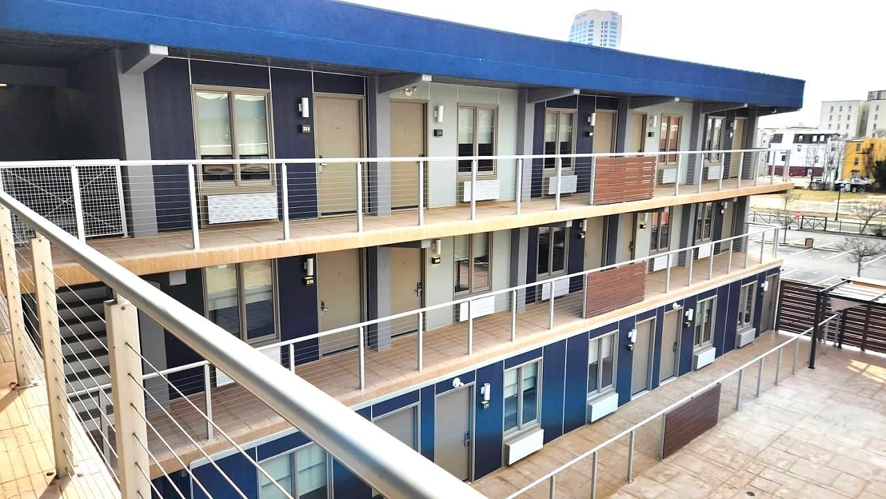 A large building with a lot of windows and balconies.