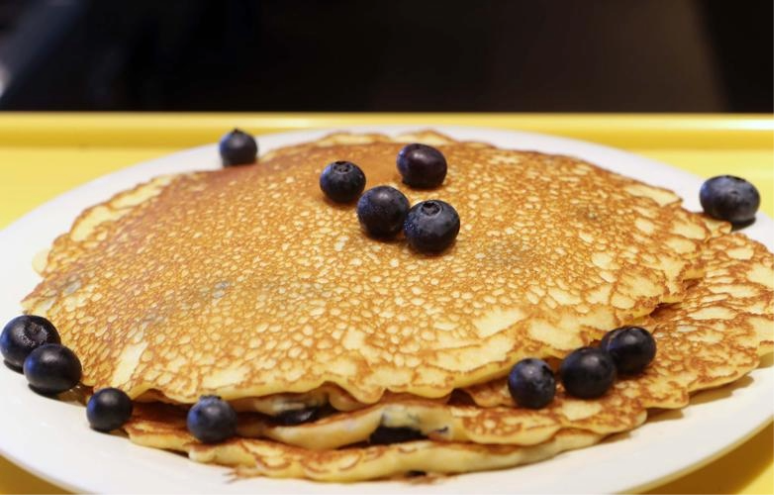 A stack of pancakes with blueberries