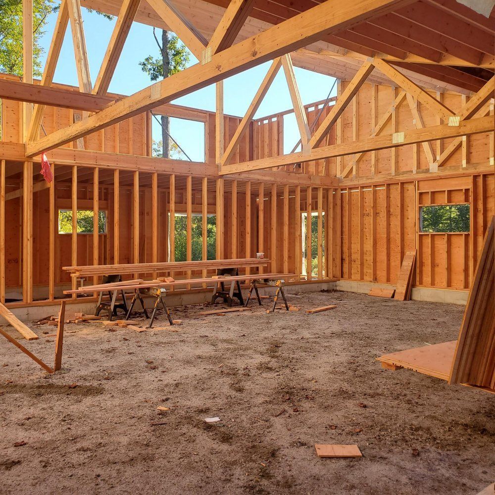 The inside of a building under construction with wooden beams