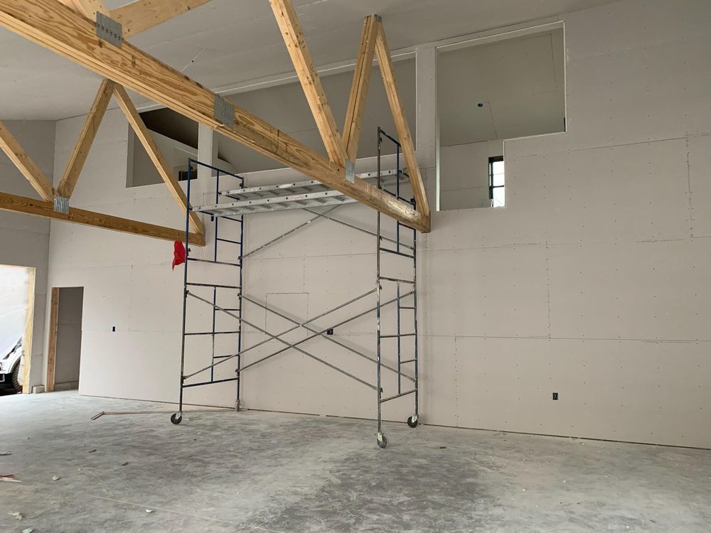 An empty room with a scaffolding in the middle of it.