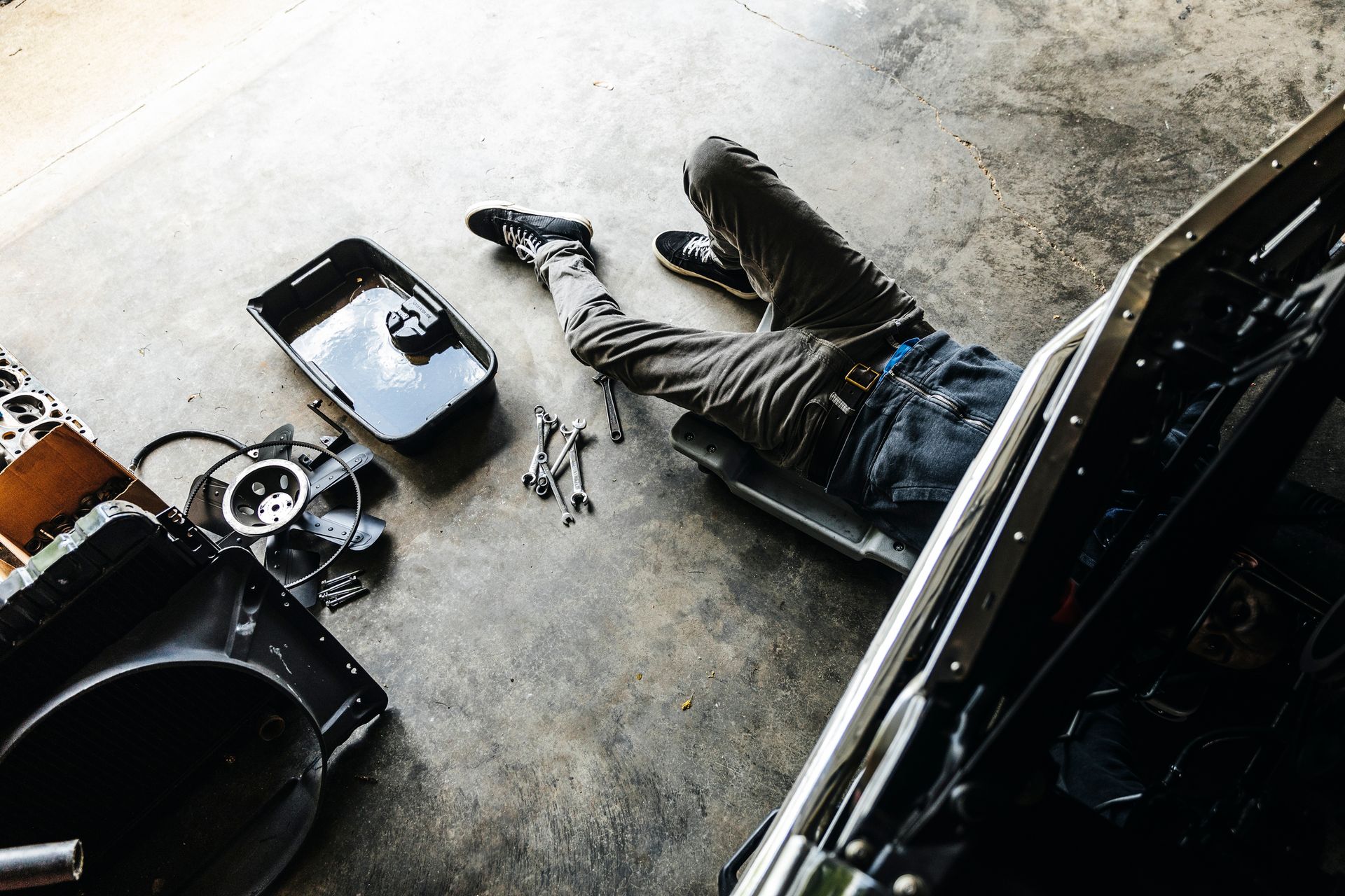 A car is being worked on in a garage.