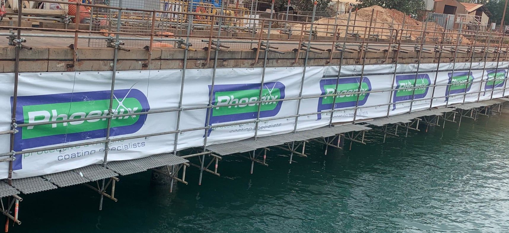 Bridge Walkway With White Banners — Phoenix Protective & Marine Coating Specialists in Woree, QLD