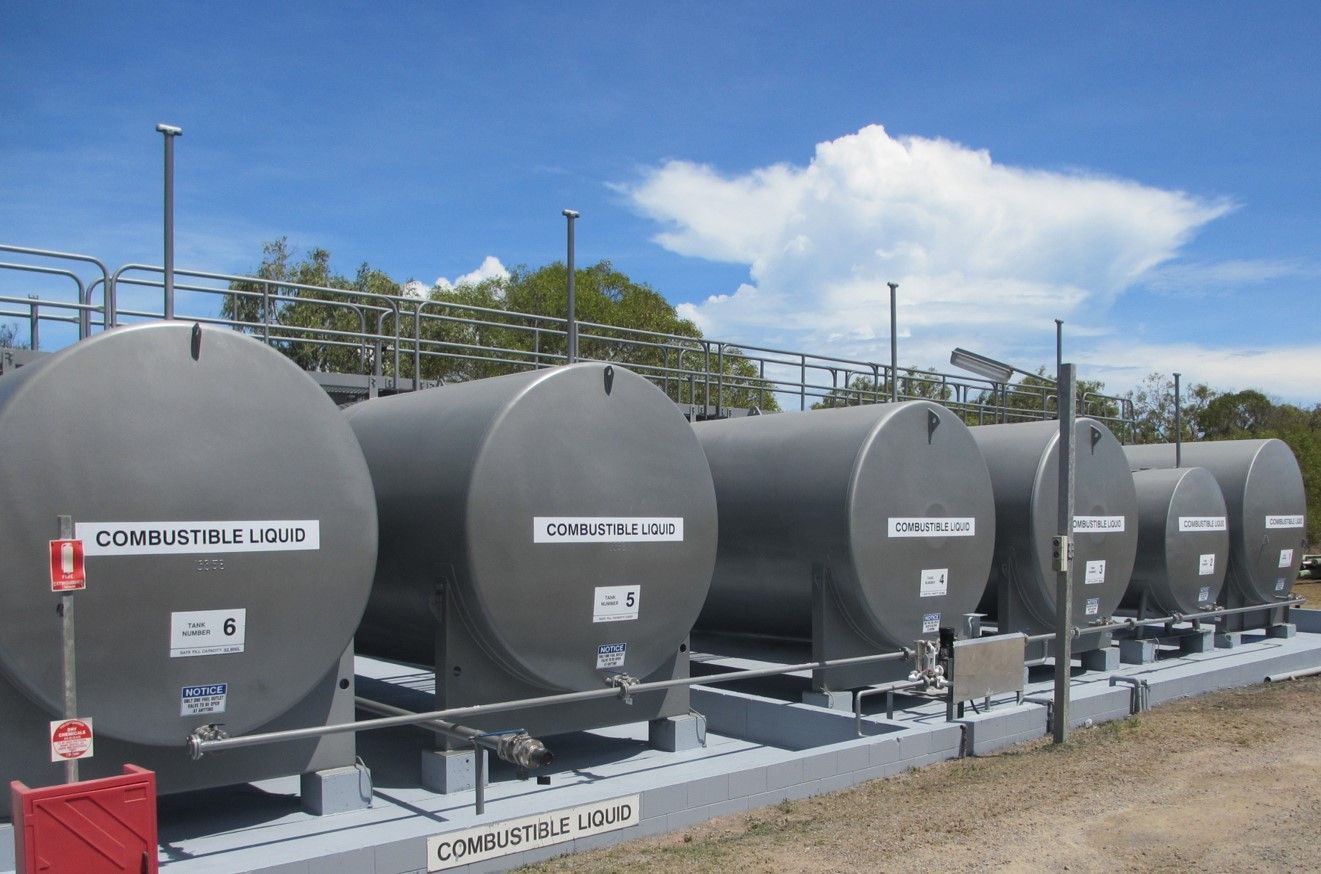 Row of Gray Cylindrical Fuel Tanks — Phoenix Protective & Marine Coating Specialists in Woree, QLD