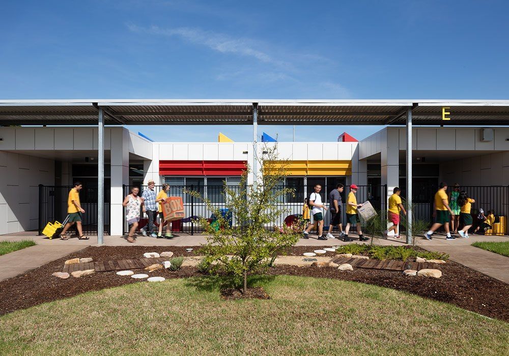 People Entering a Modern School Building — Phoenix Protective & Marine Coating Specialists in Woree, QLD