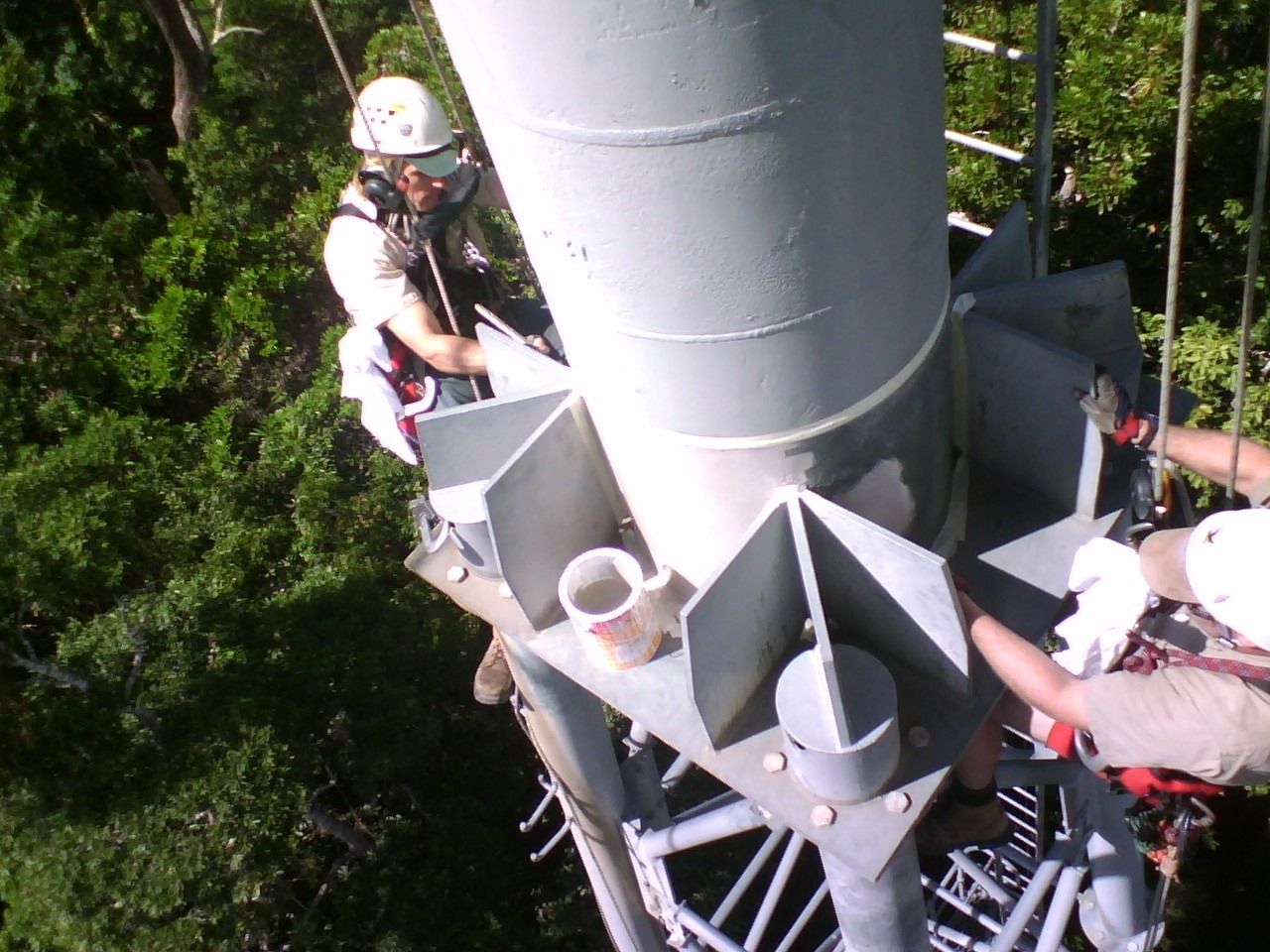 Workers Climbing a Large Metal Tower — Phoenix Protective & Marine Coating Specialists in Woree, QLD