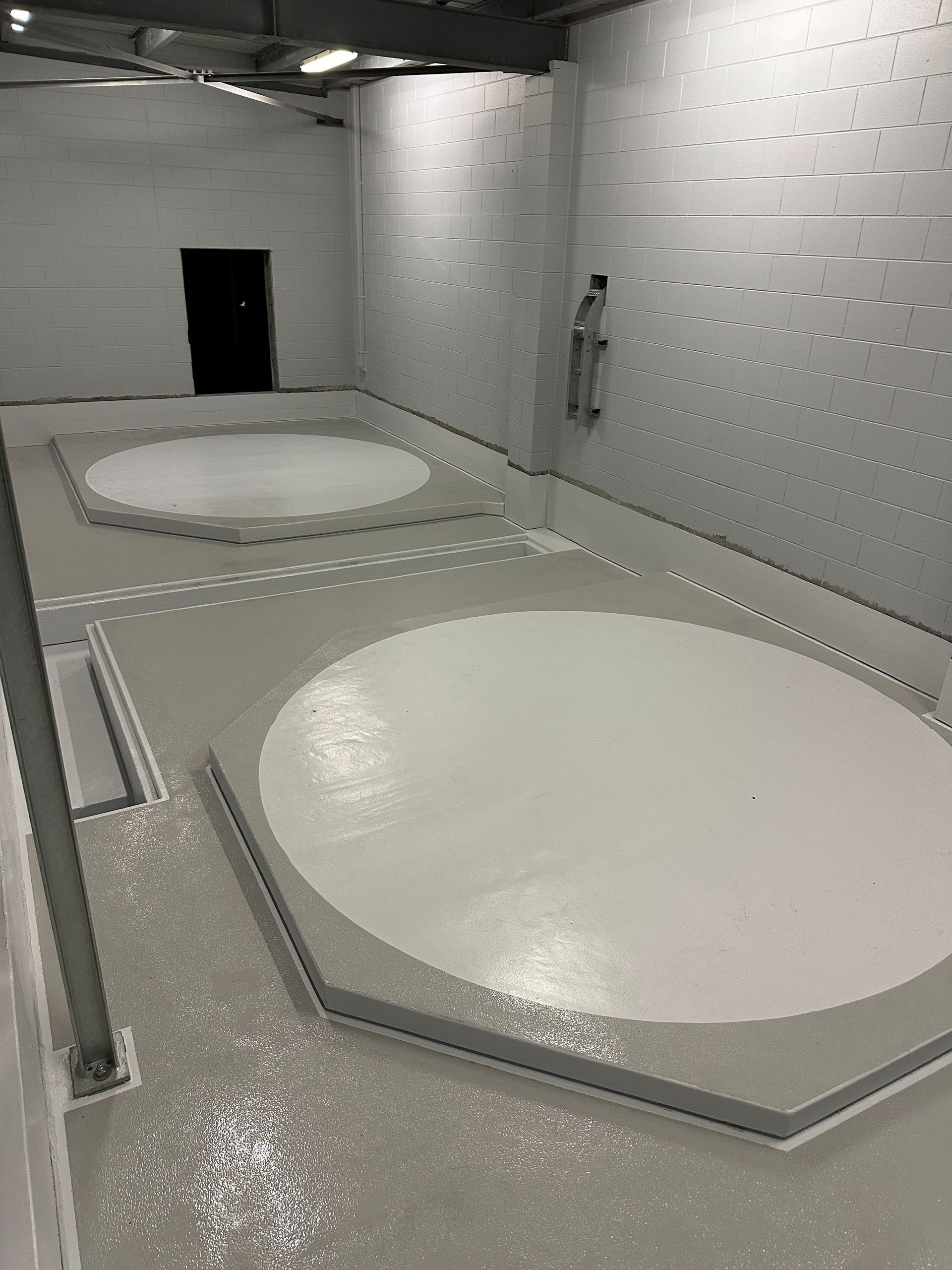 Industrial Room with Two Large Circular White Tanks or Basins — Phoenix Protective & Marine Coating Specialists in Woree, QLD