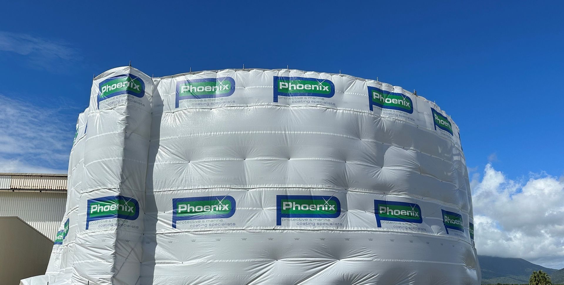 White Wrapped Cylindrical Stack of Insulation Bundles — Phoenix Protective & Marine Coating Specialists in Woree, QLD