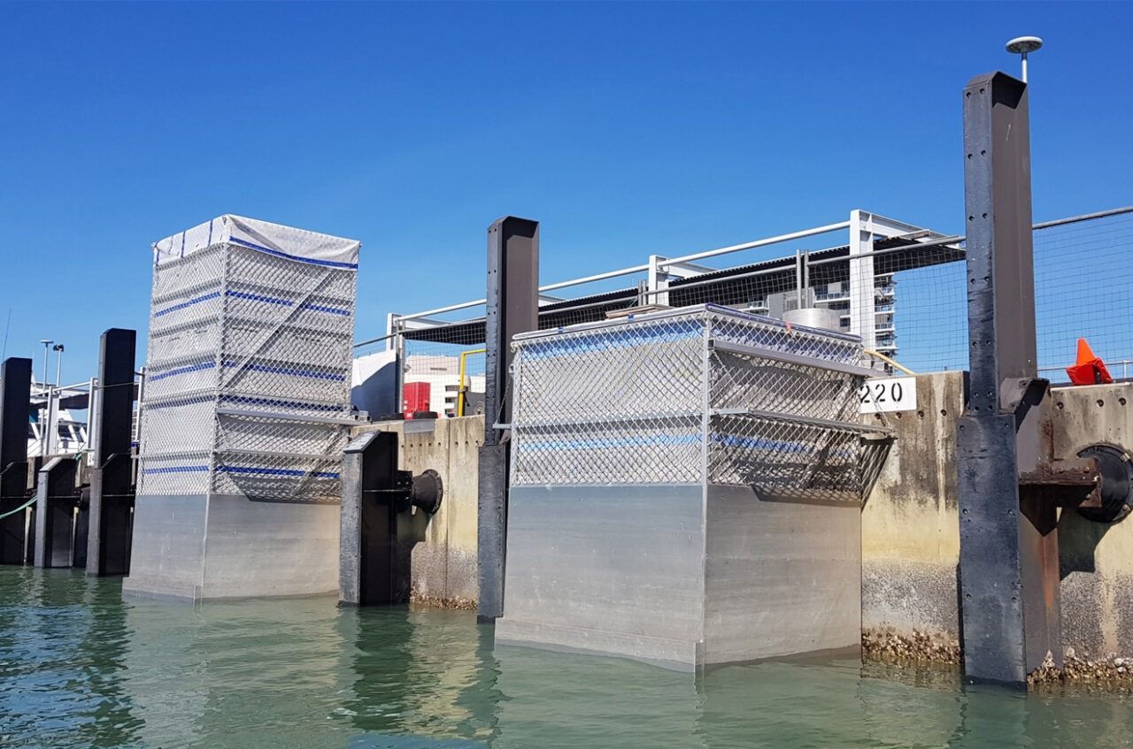 Metal Water Control Structures at a Dock, Covered in Mesh — Phoenix Protective & Marine Coating Specialists in Woree, QLD