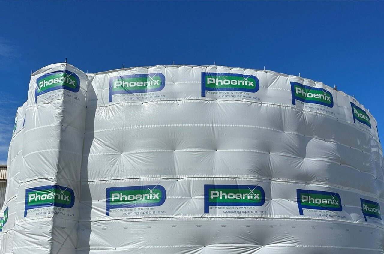 A Large Cylindrical Structure Wrapped in White Protective — Phoenix Protective & Marine Coating Specialists in Woree, QLD