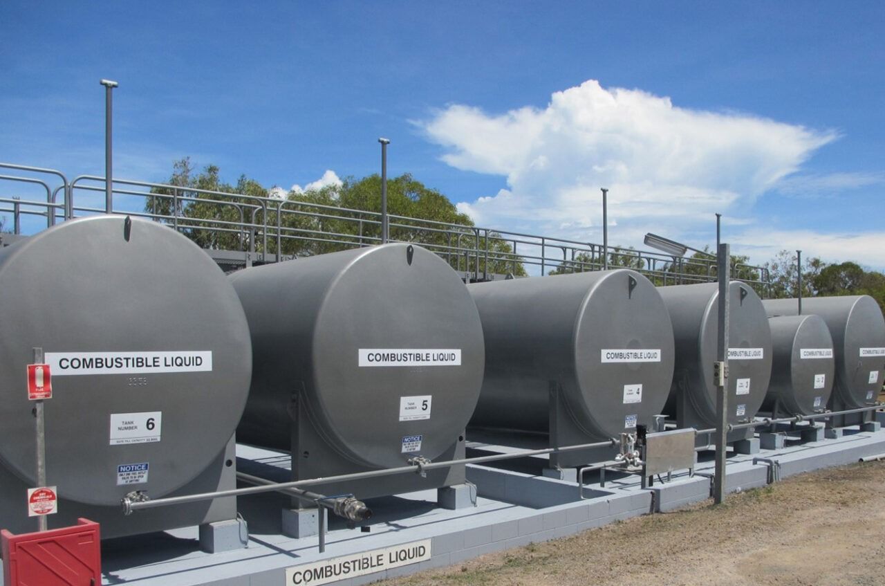 Row of Large, Gray Storage Tanks Outdoors — Phoenix Protective & Marine Coating Specialists in Woree, QLD