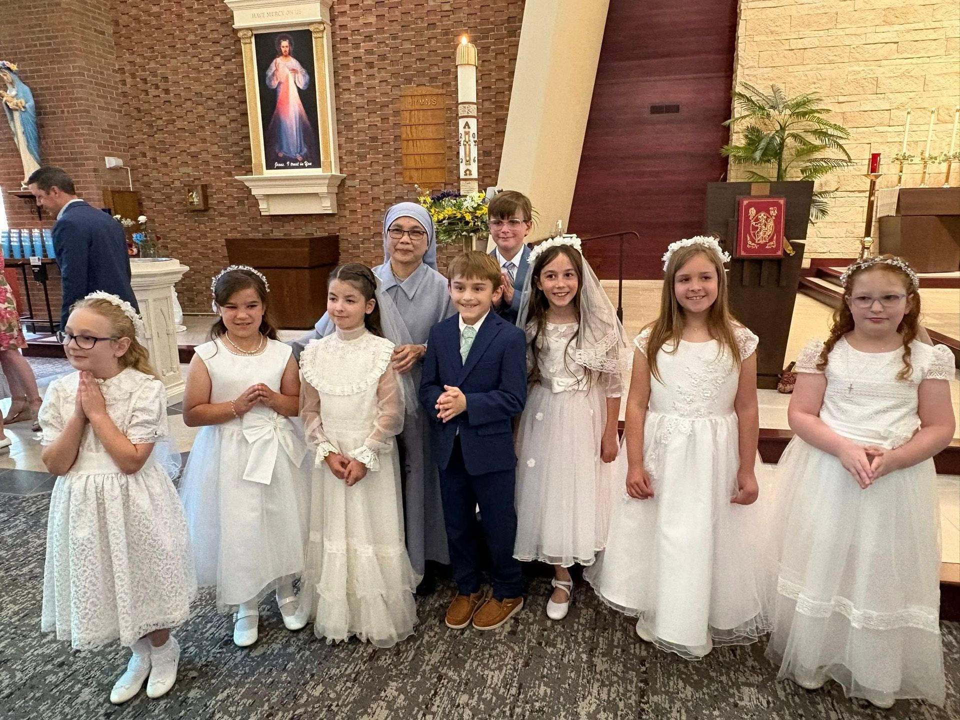 Children in costumes pose in front of