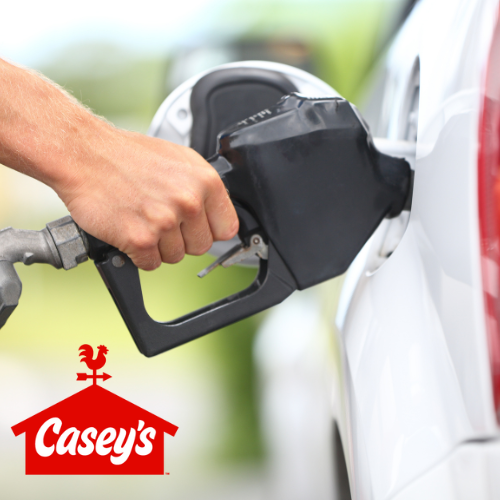 Hand pumping gas into a white car at a Casey's gas station.