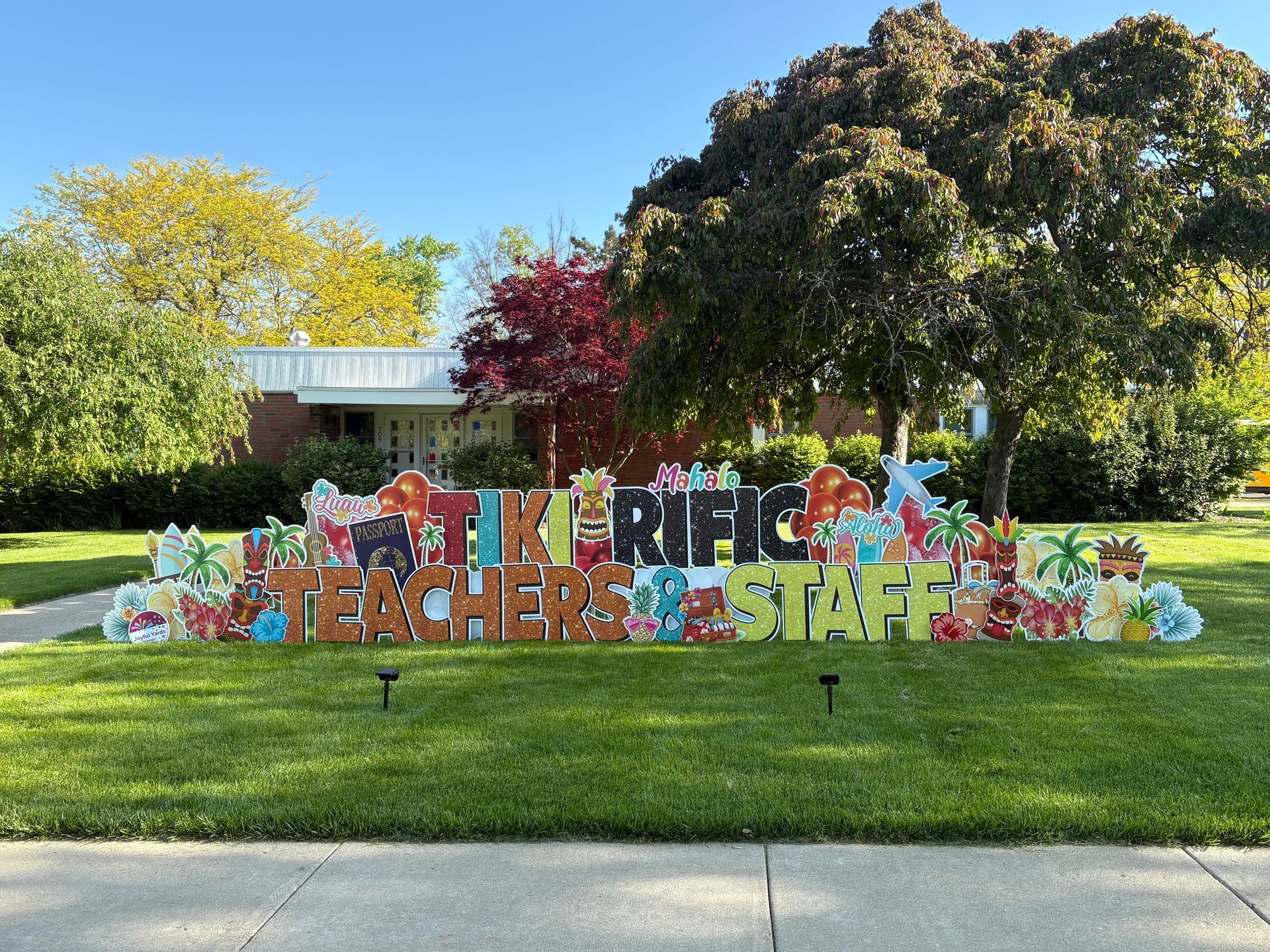 Sign on grass reads