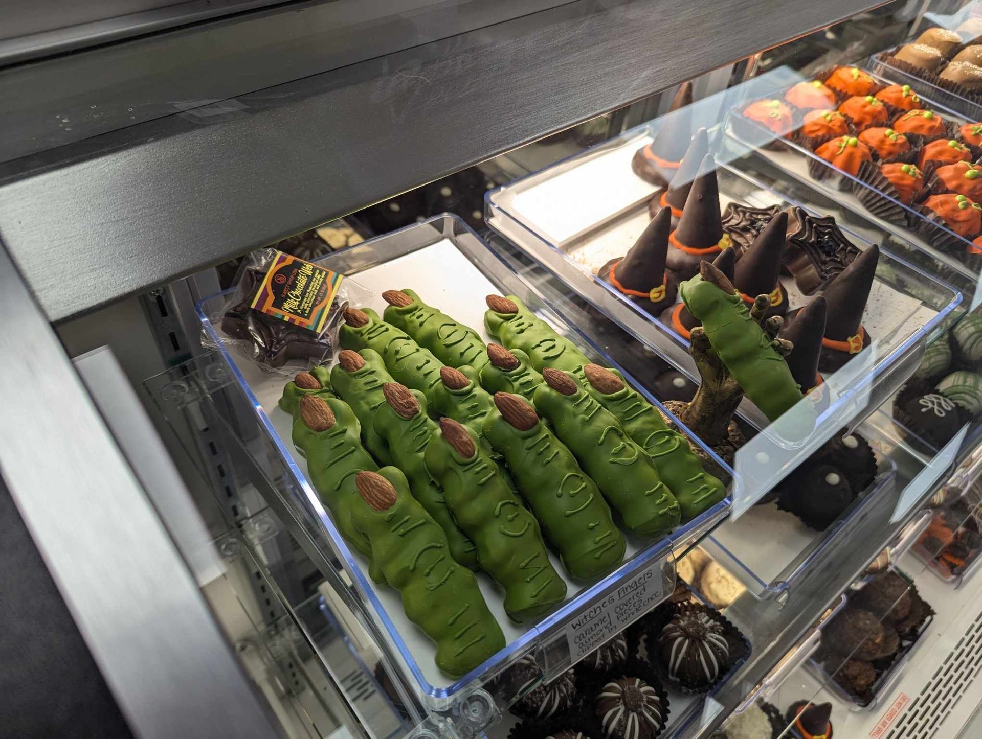 A Display Case Filled with a Variety of Halloween Themed Desserts — Summerville, SC — Donovan's Custom Framing and Gifts