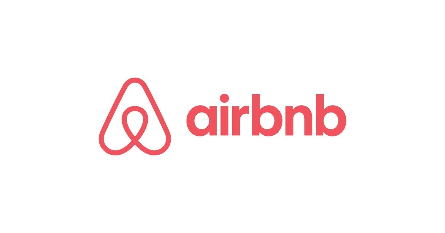 Airbnb logo: a red stylized A-shaped icon with a loop, next to red text 