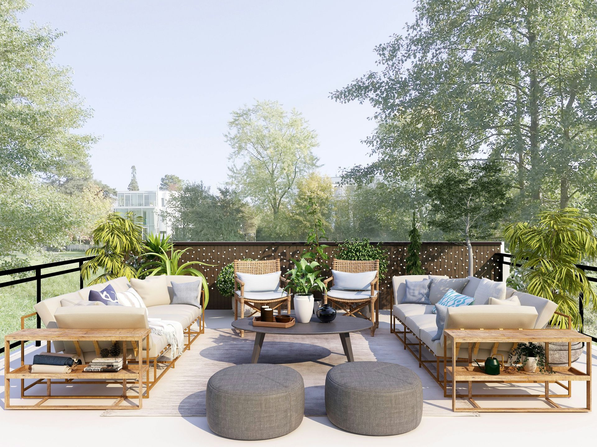 Outdoor patio lounge with cream sofas, wooden chairs, round ottomans, and trees beyond the deck.