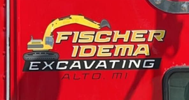 Fischer Idema Excavating logo on a red truck, with “Alto, MI” beneath it