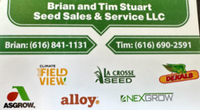 Green business sign for Brian and Tim Stuart Seed Sales & Service LLC with phone numbers and farm brand logos