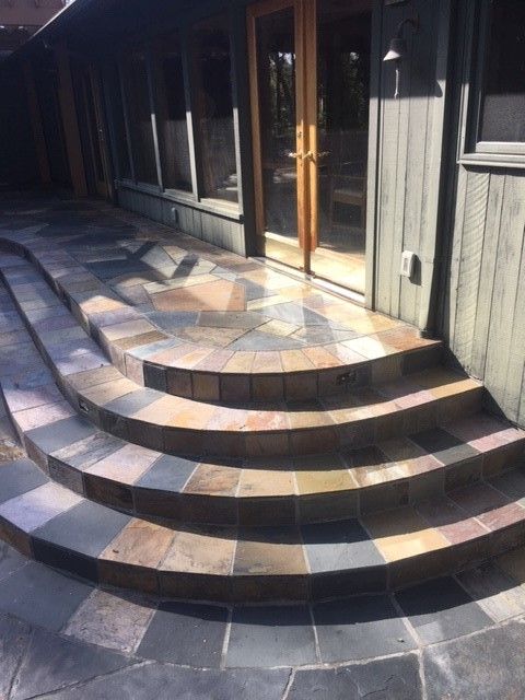 A set of curved steps leading up to a house