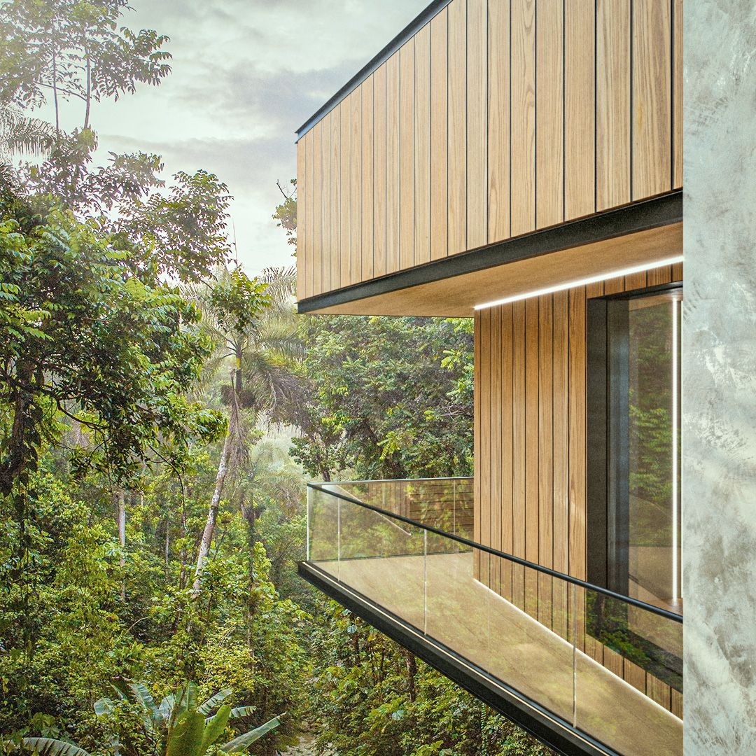Modern wooden house balcony overlooking lush green forest.