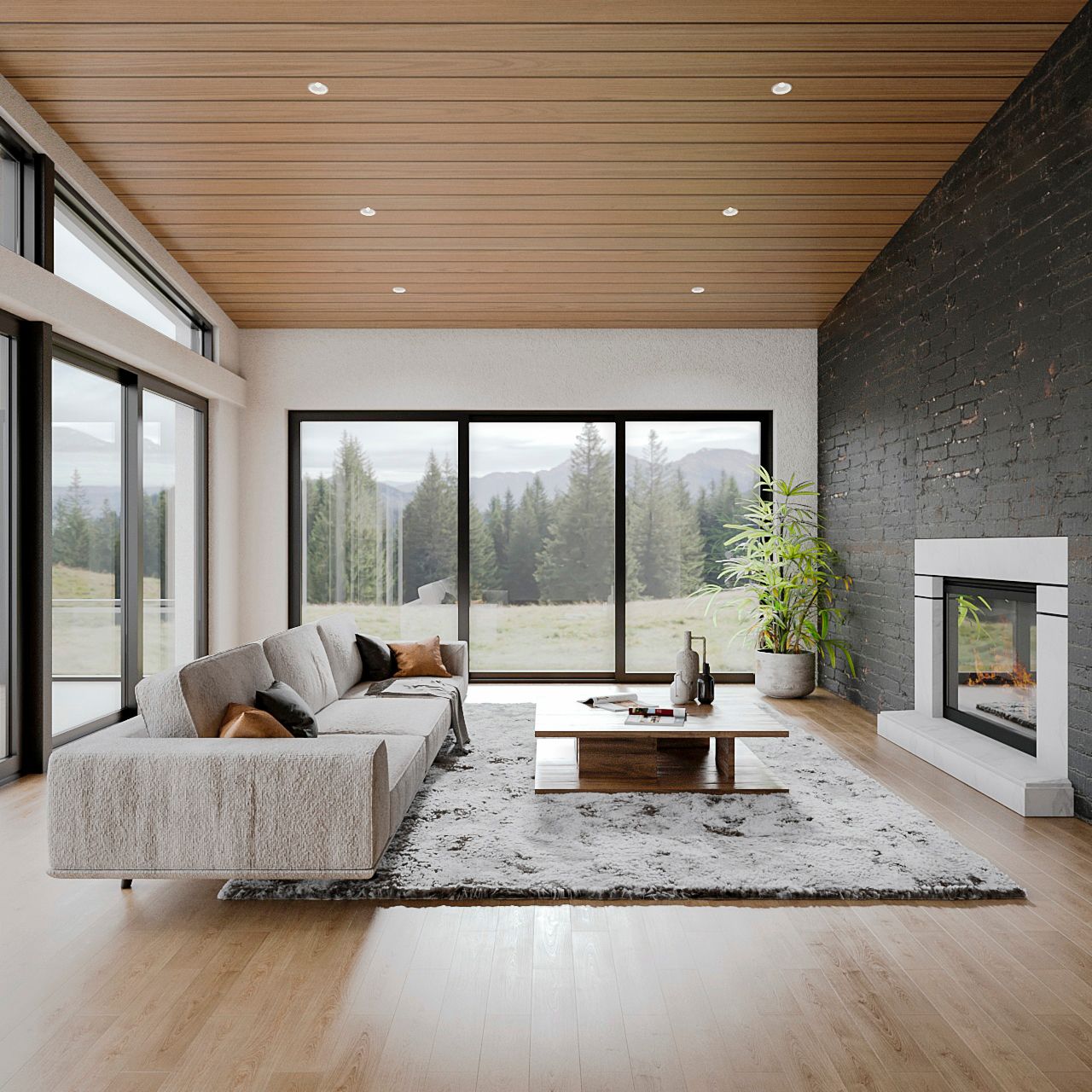 Modern living room with gray sectional, fireplace, and large windows overlooking a mountain view.