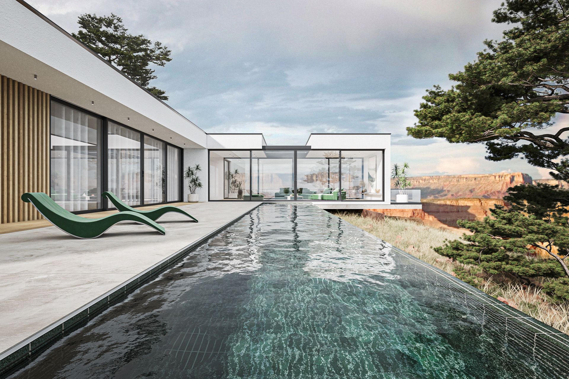 Modern house with infinity pool overlooking canyon, green lounge chairs, glass walls, blue water.