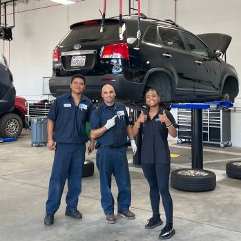 Technicians Standing in an Automobile Repair Shop | Crown City Tire Auto Care
