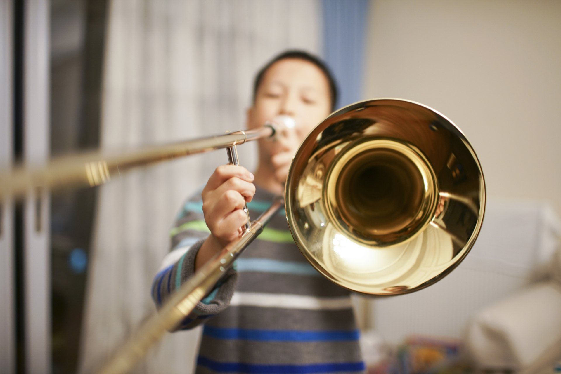 Boy Playing Trombone — Los Alamitos, CA — Applied Music Studio Boy Playing Trombone — Los Alamitos, CA — Applied Music Studio