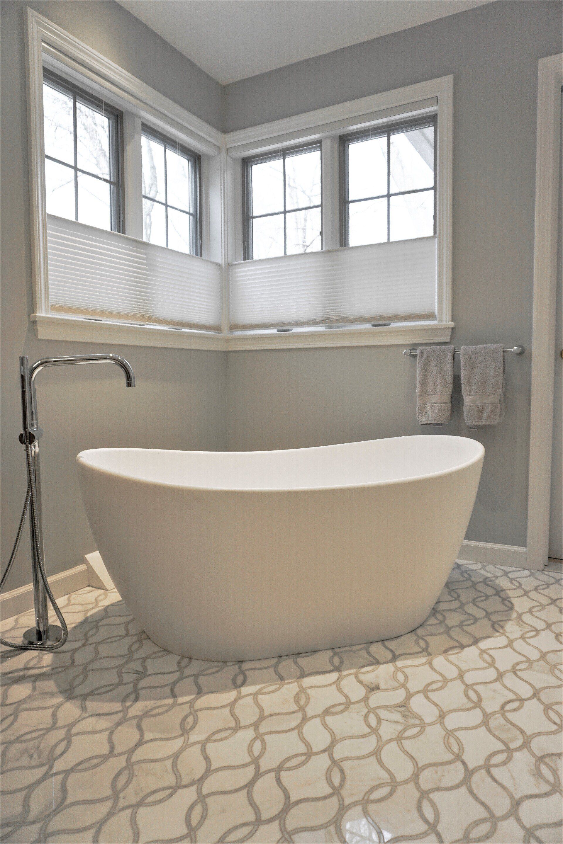 a spa for two bathroom remodel featuring a large tub