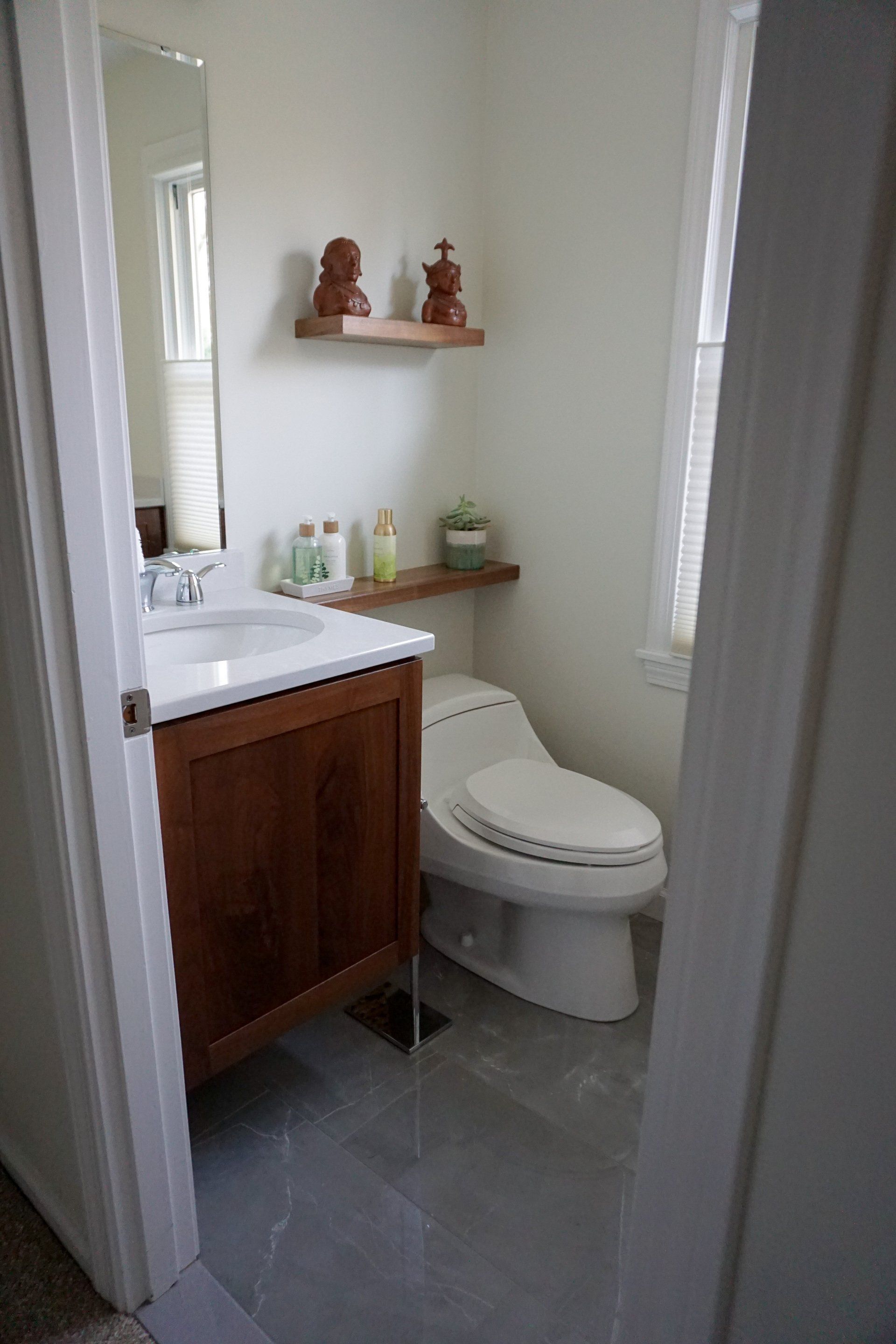 small bathroom remodel in West Springfield featuring new toilet, small modern sink and vanity stained dark wood