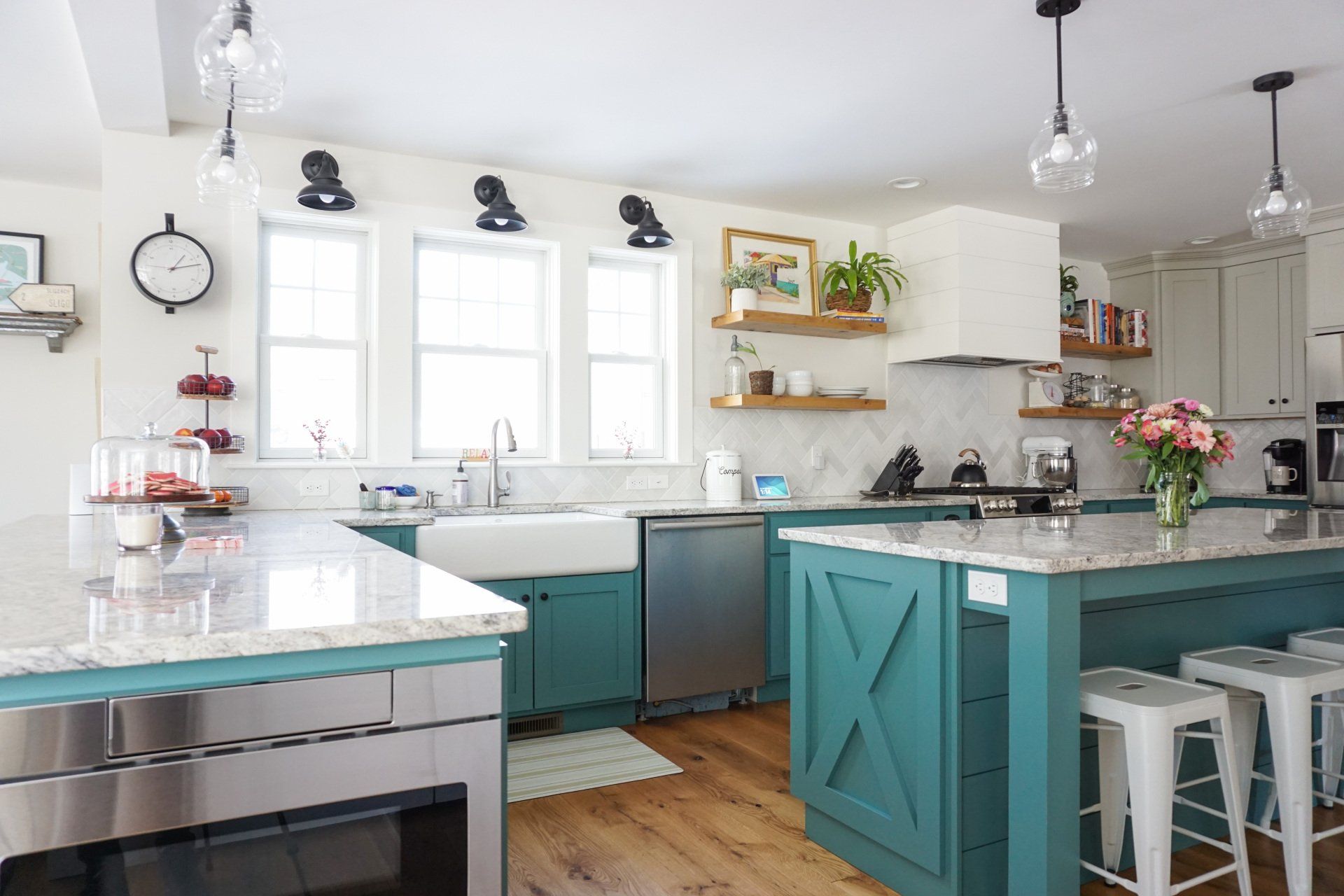 farmhouse kitchen renovation with blue cabinets, white backsplash and large island