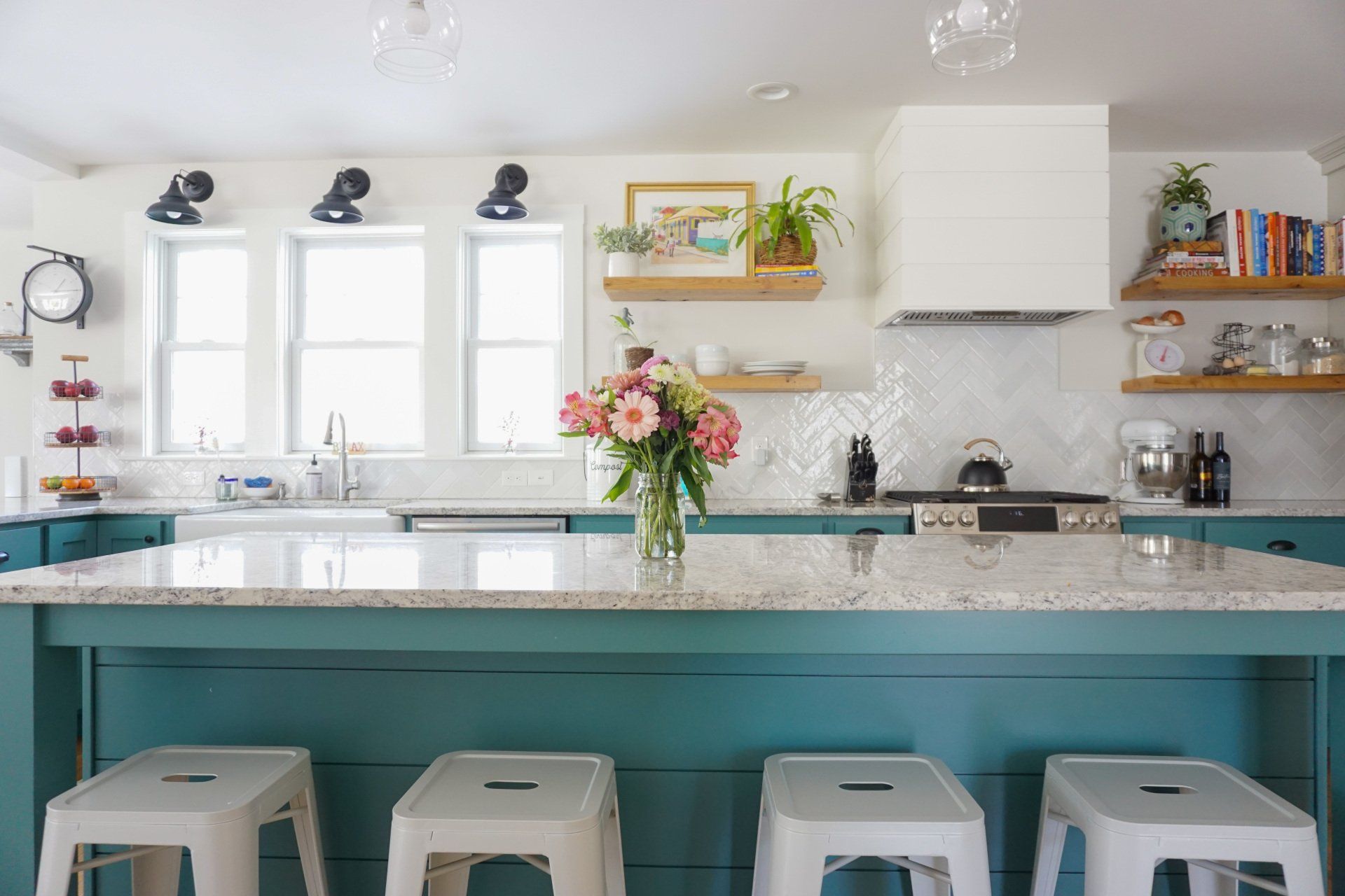 farmhouse kitchen renovation with blue cabinets, white backsplash and large island