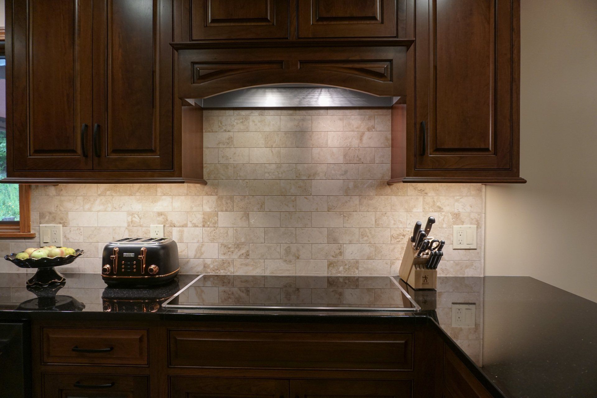 a toaster sits on top of a stove in a kitchen