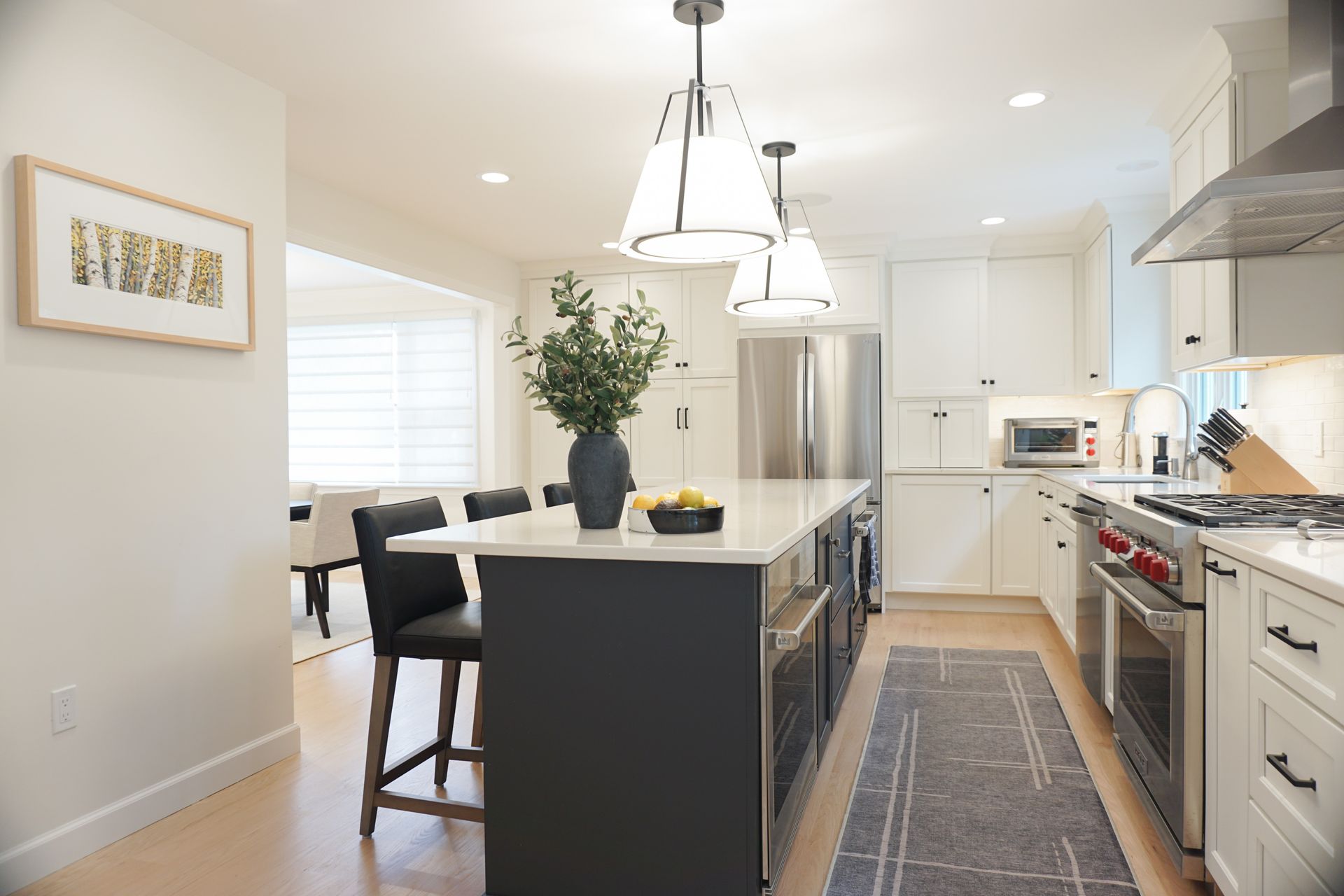Bright modern kitchen with island installed by Chapdelaine Builders