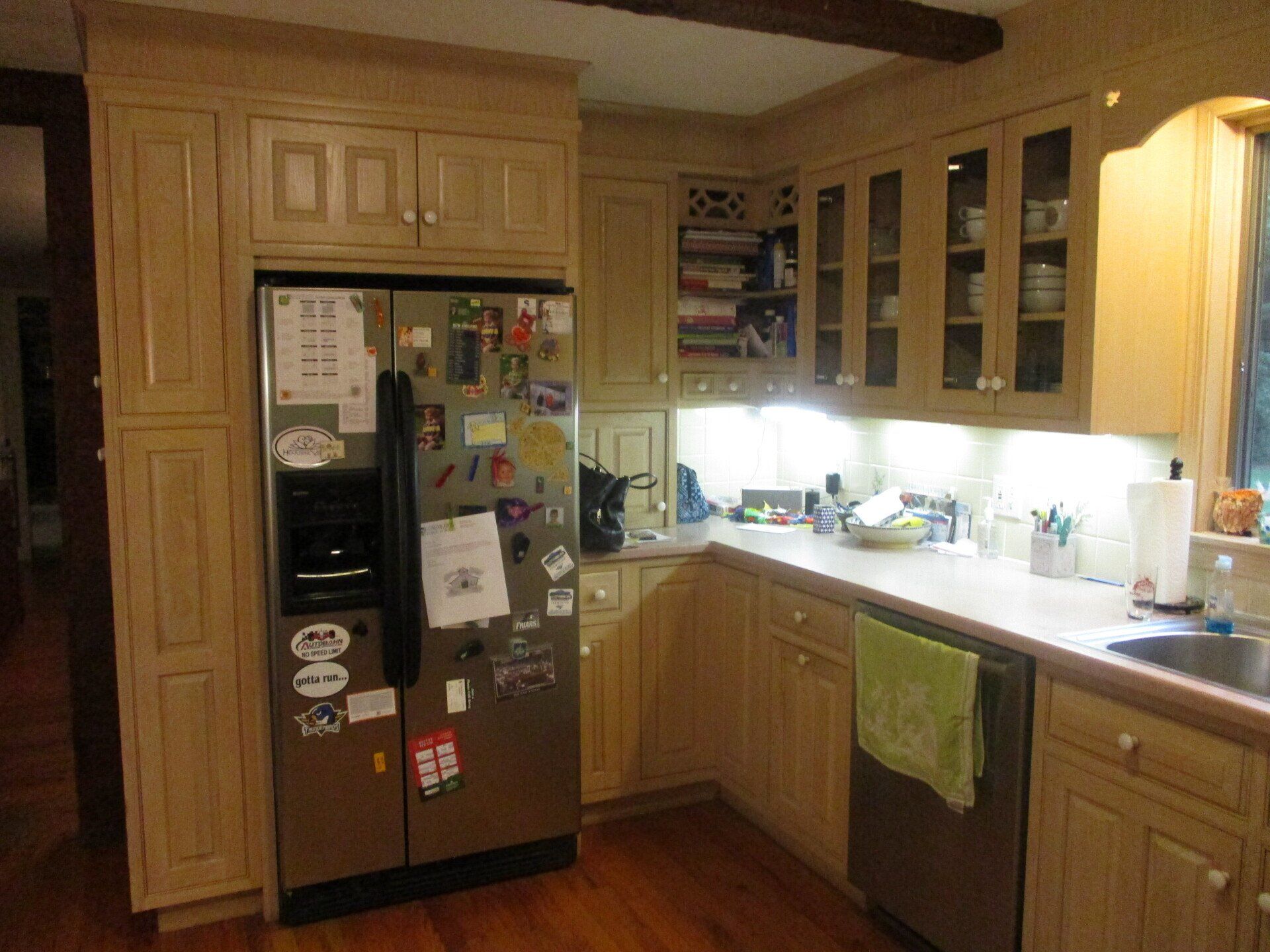 A kitchen with stainless steel appliances and wooden cabinets