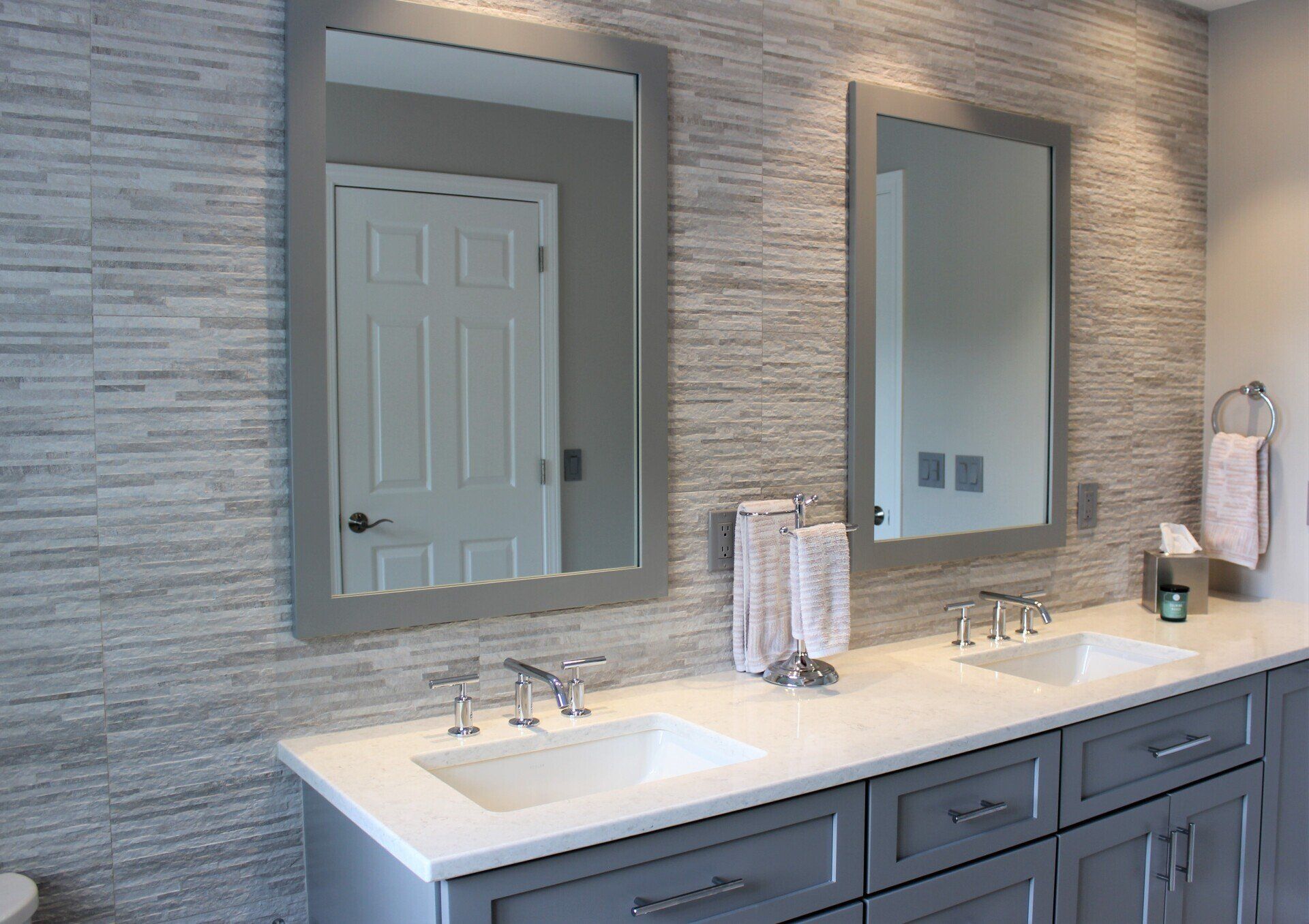new modern bathroom renovation with double sinks and mirrors