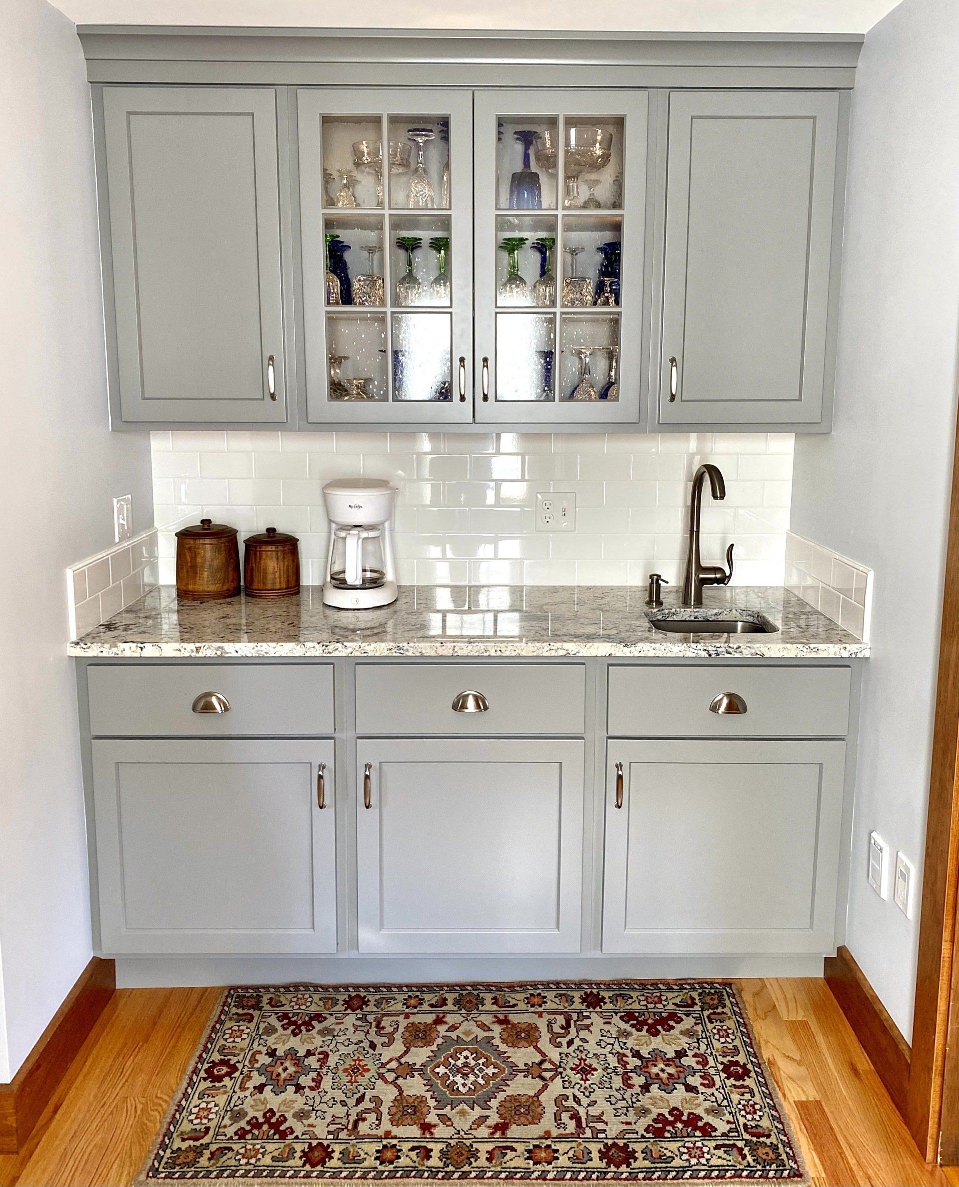 a coffee maker sits on a counter in a kitchen
