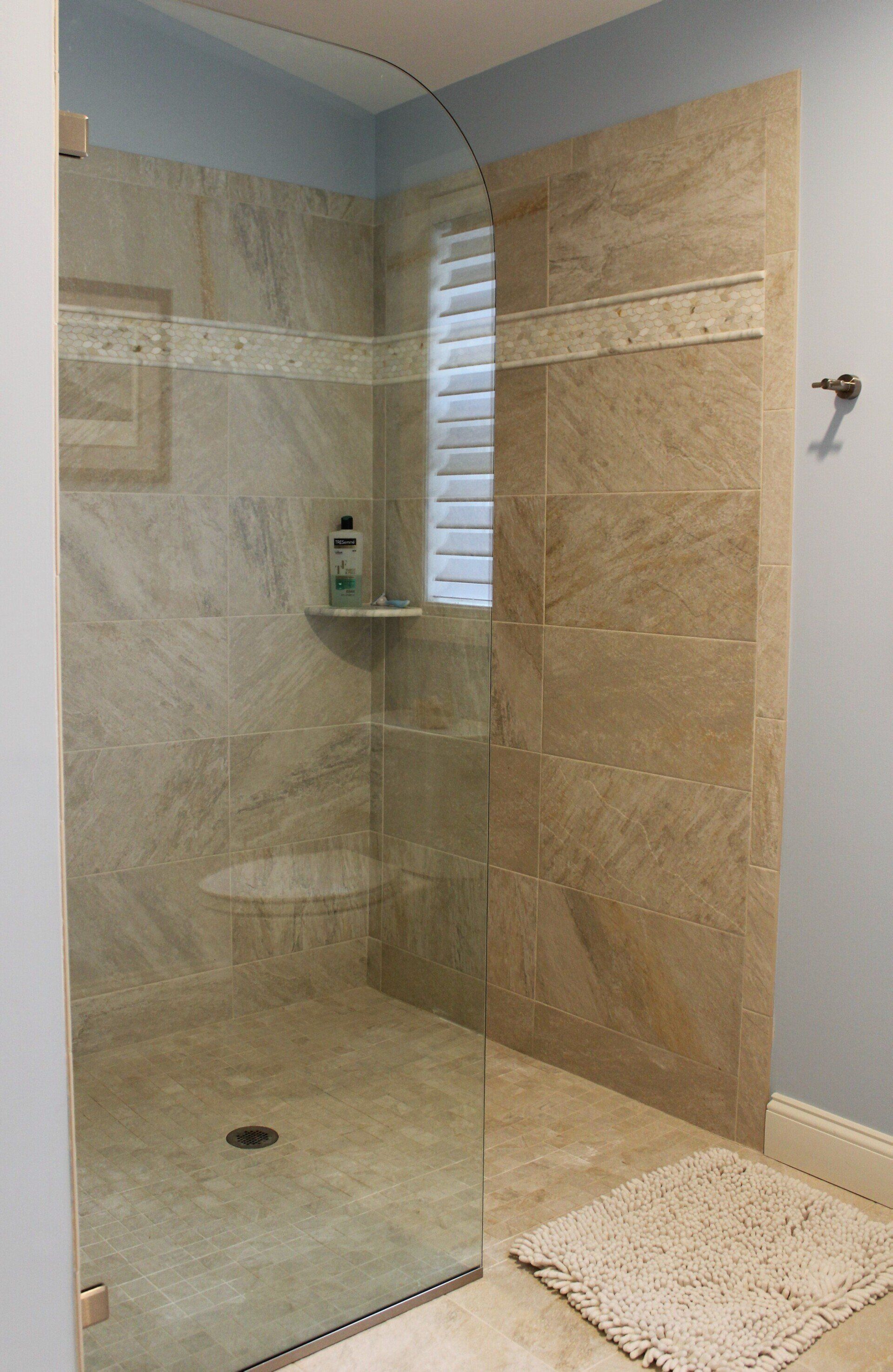 New bathroom remodel by Joseph Chapdelaine & Sons - tan and brown tile design for walk in shower