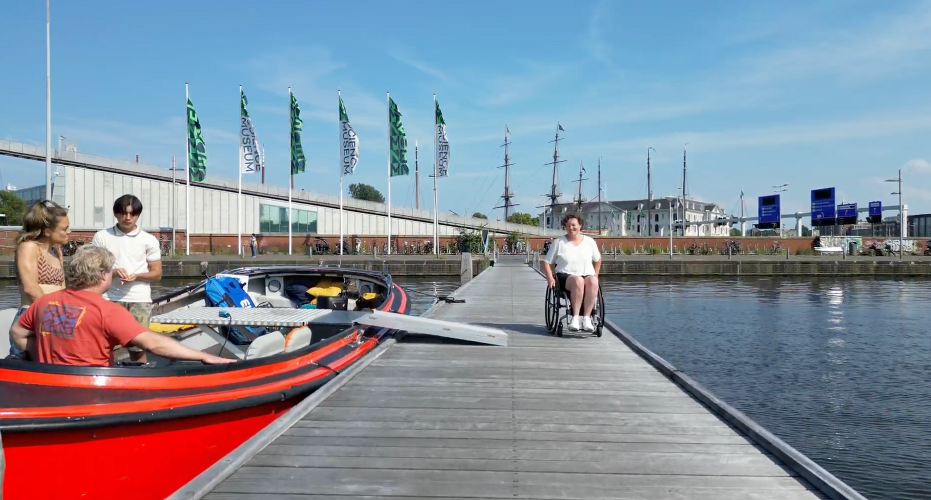 A wheelchair user enjoying a comfortable canal tour in Amsterdam.