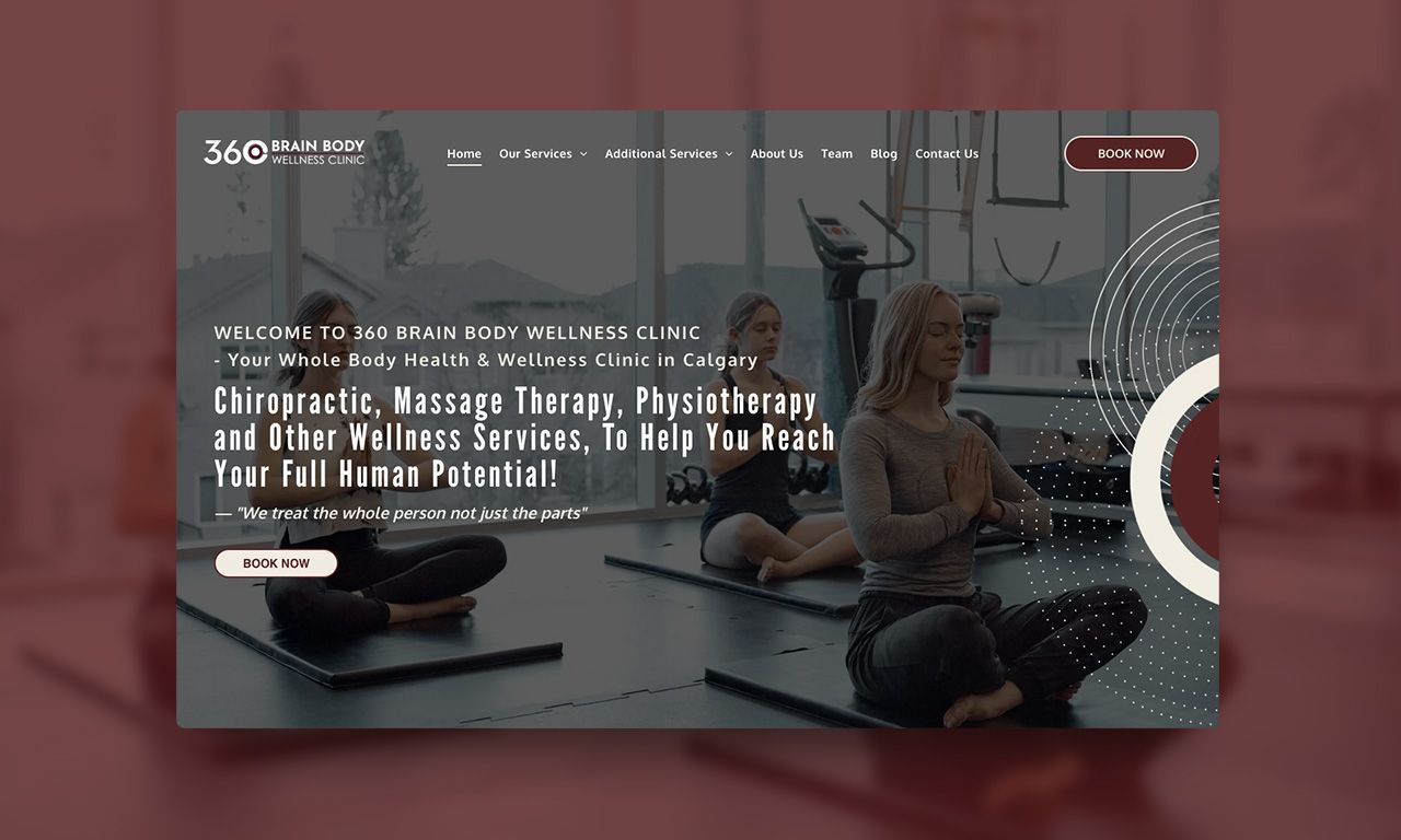 A group of people are sitting on yoga mats in a gym.