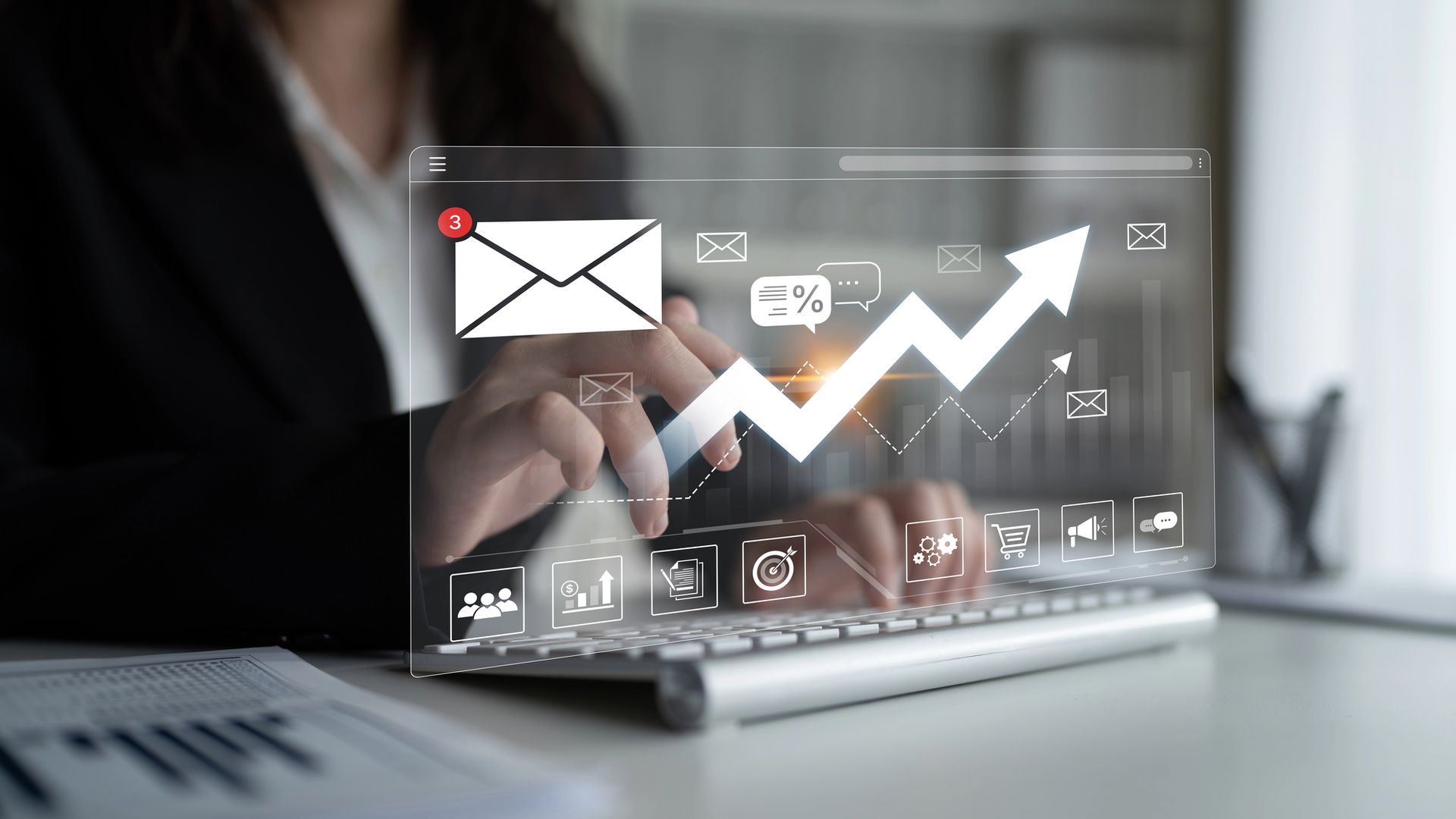Businessman using laptop with digital analytics dashboard and rising chart icons