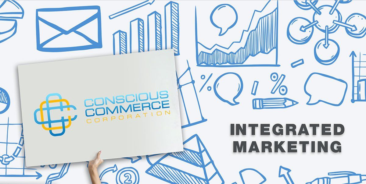 A person is holding a sign that says integrated marketing.