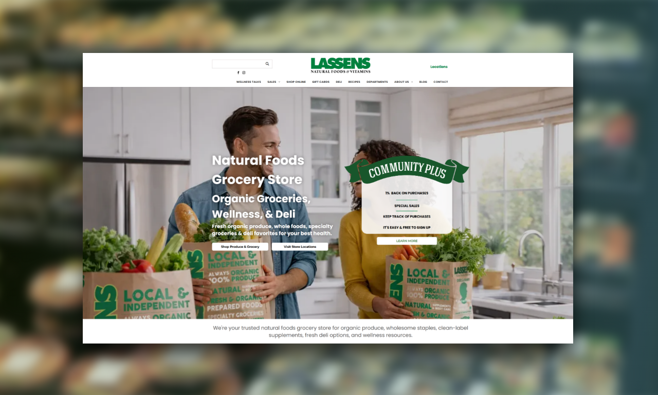 Two people unpacking Local roots organic produce boxes in a bright kitchen, with website promo text overlay.