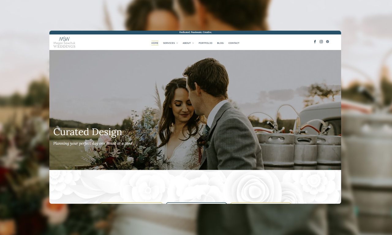 A bride and groom are kissing on their wedding day on a website.