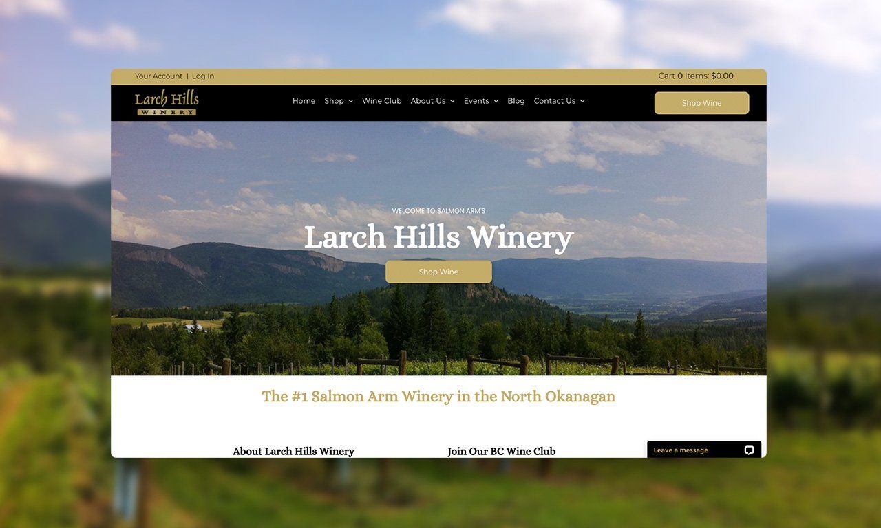 A website for larch hills winery is displayed on a computer screen