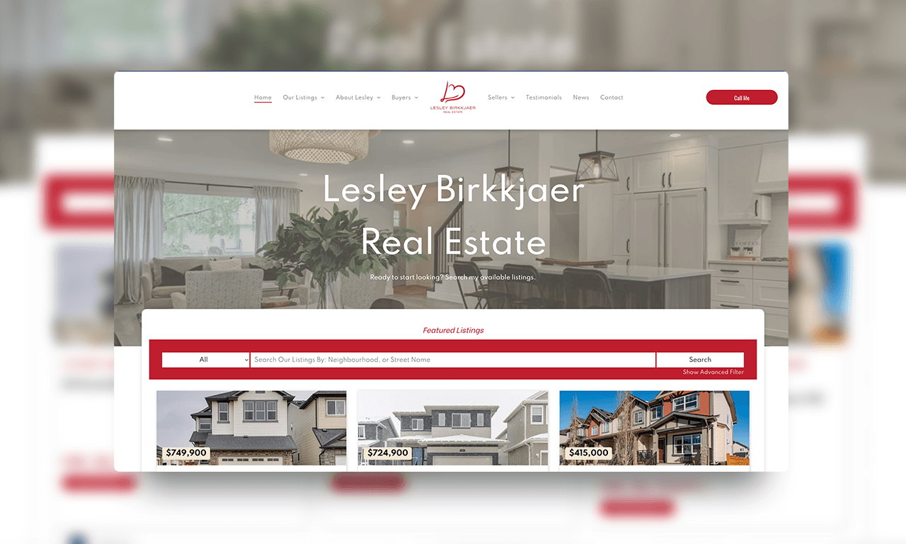 The website for lesley birkjaer real estate is displayed on a computer screen.