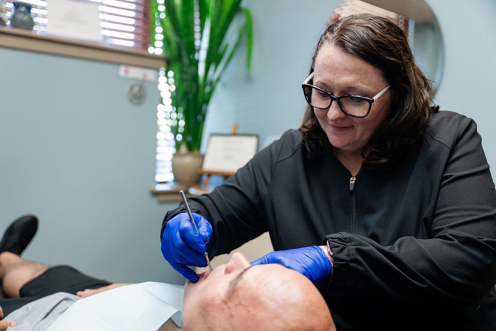 Dental hygienist performing a professional cleaning at Robert A. Lantzy DMD, Cleanings & Exams in Newtown, PA