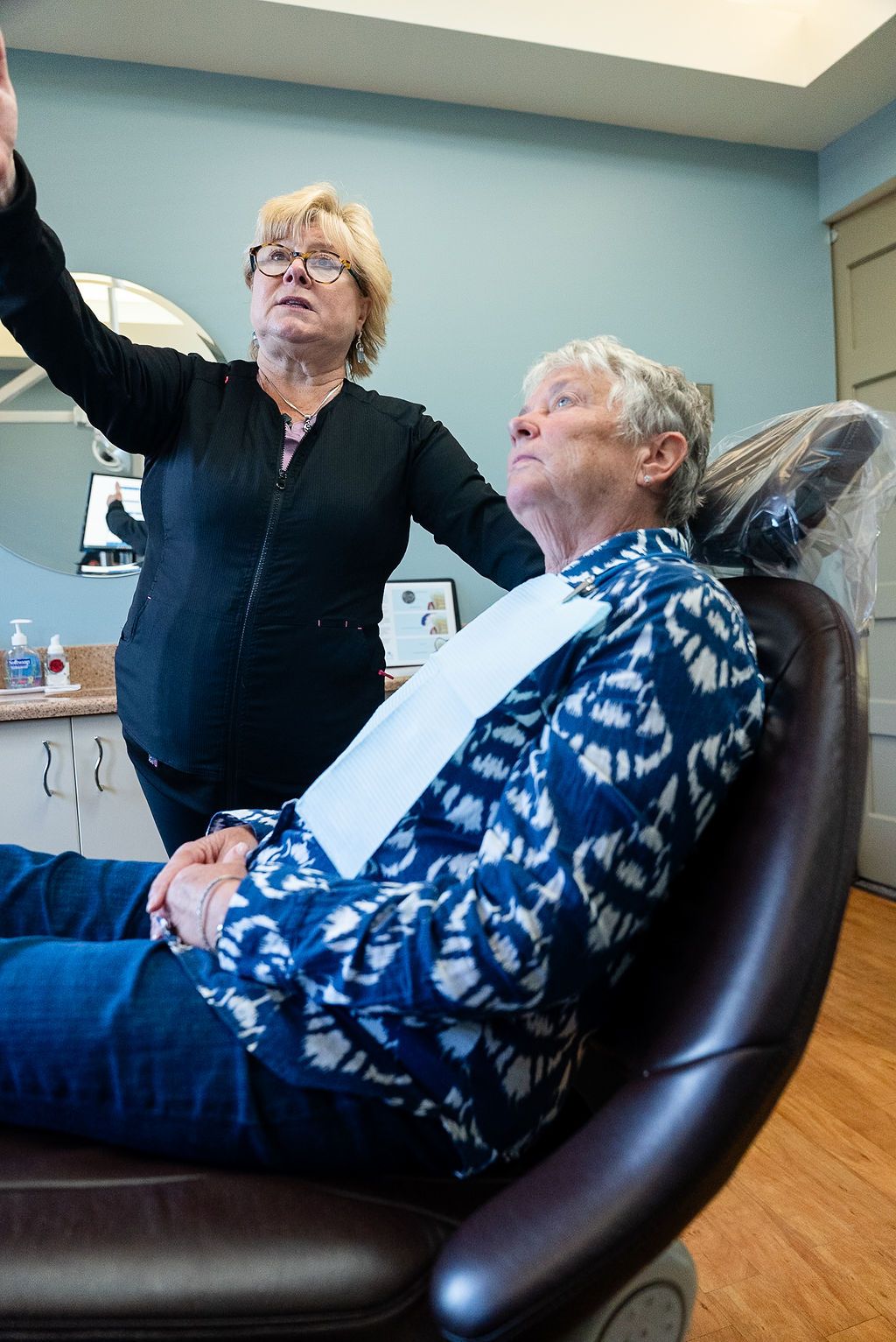 Dentist reviewing a patient's health assessment at Robert A. Lantzy DMD, Comprehensive Dental Exams in Newtown, PA