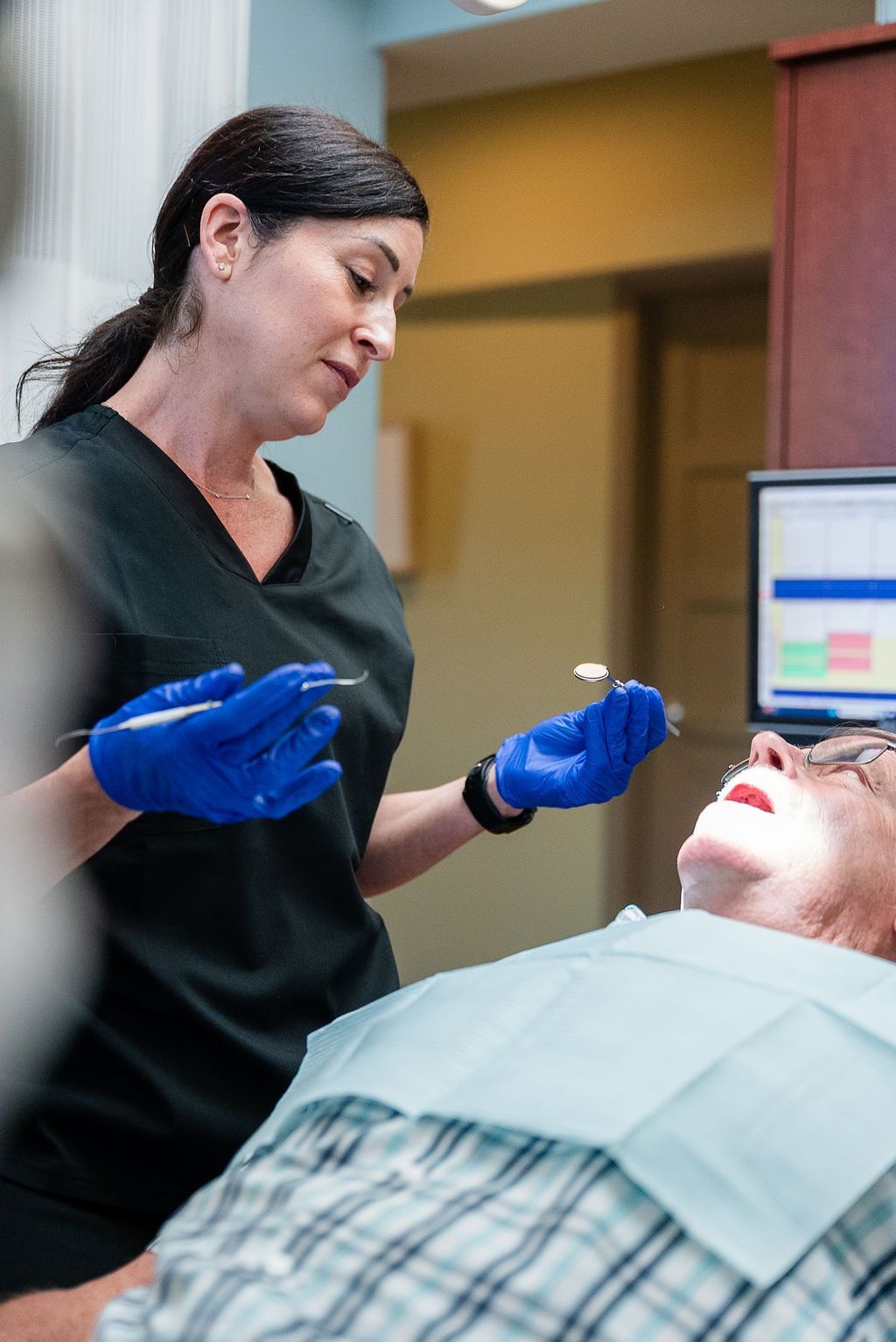Dentist examining a patient at Robert A. Lantzy DMD, Comprehensive Dental Exams in Newtown, PA