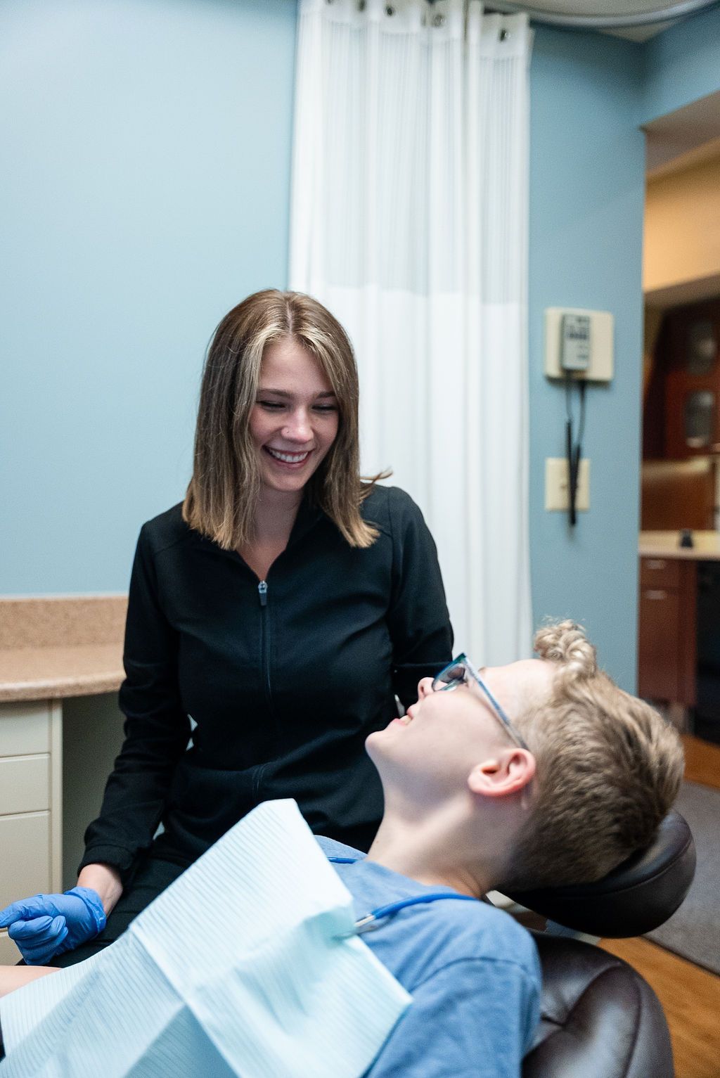 Dentist caring for a young patient at Robert A. Lantzy DMD, Family & Children's Dentistry in Newtown, PA